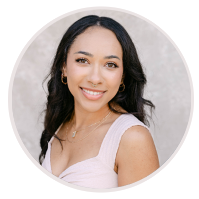 Young woman in white top smiles at the camera. Makaela - Photographer at Leah Marie Photography